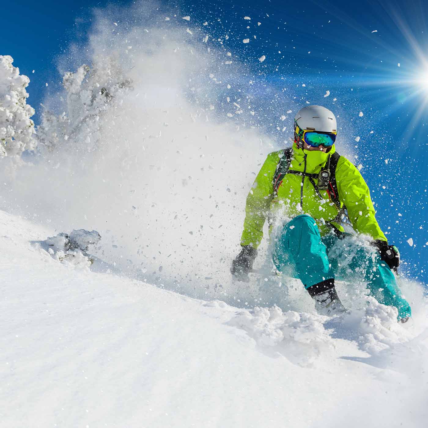 Skier hitting powder