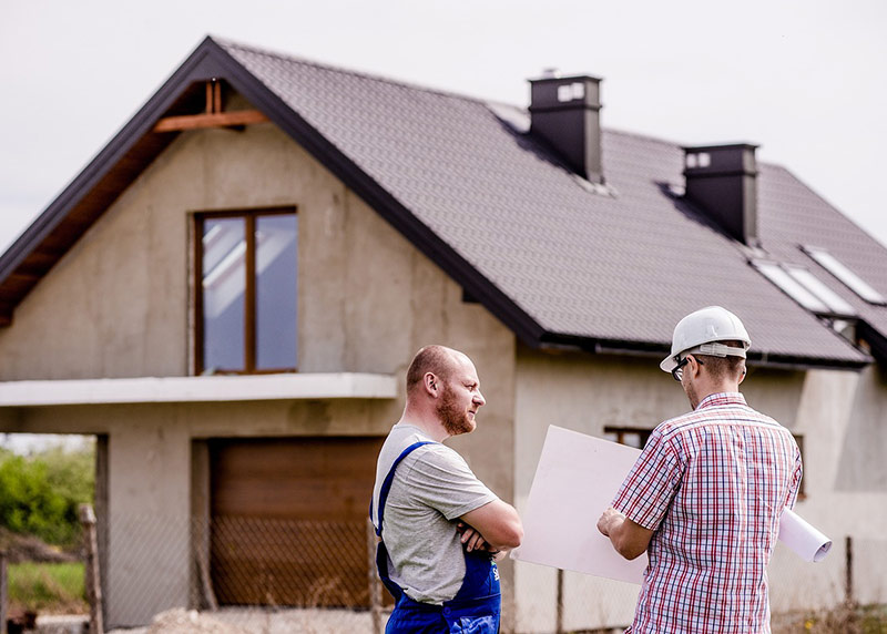 Homeowner and boundary surveyor on site