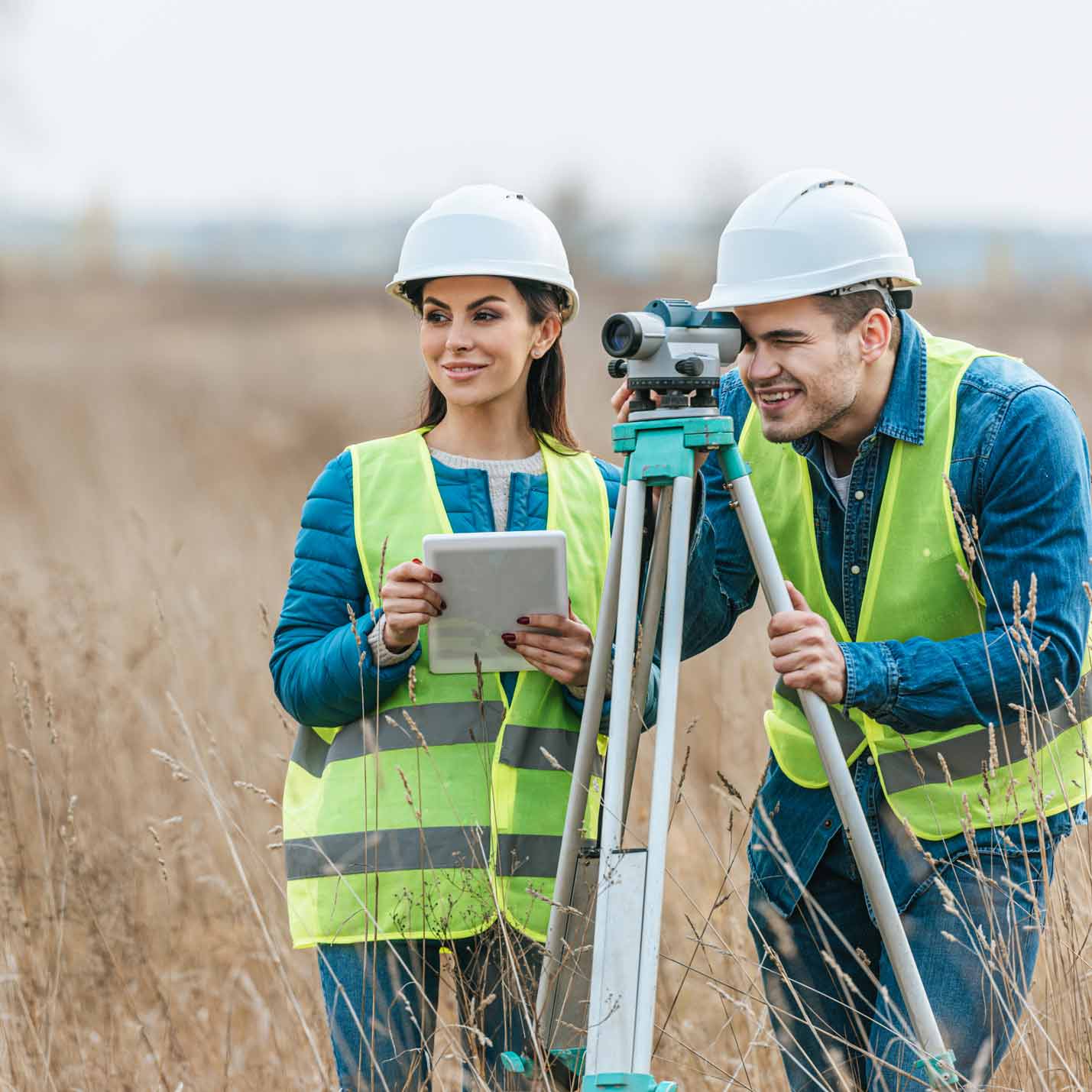 Two land surveyors out in the field