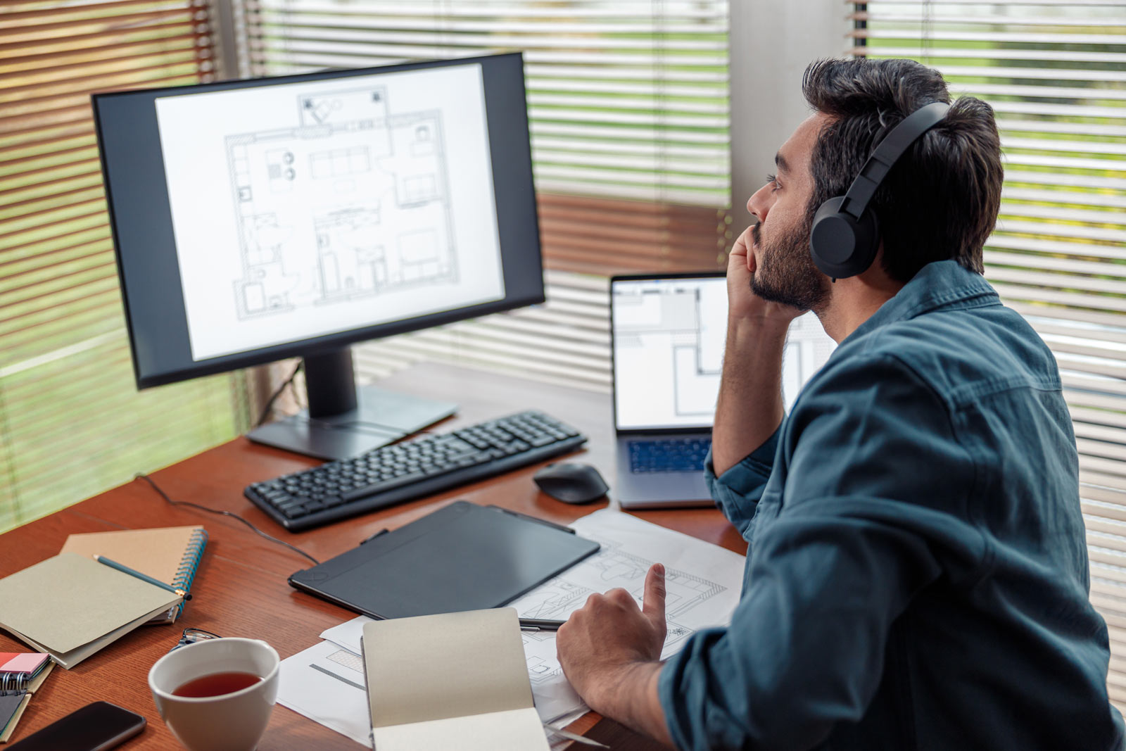 Civil engineer in front of their computer working from home